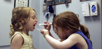 two little girl's playing doctor