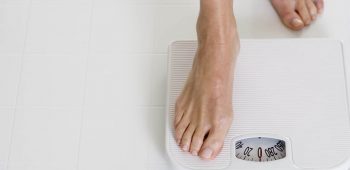 Woman Stepping onto Scale