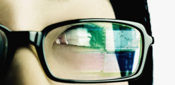 Extreme close-up of a young woman wearing eyeglasses