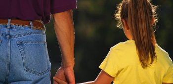 Father Holding Daughter's Hand